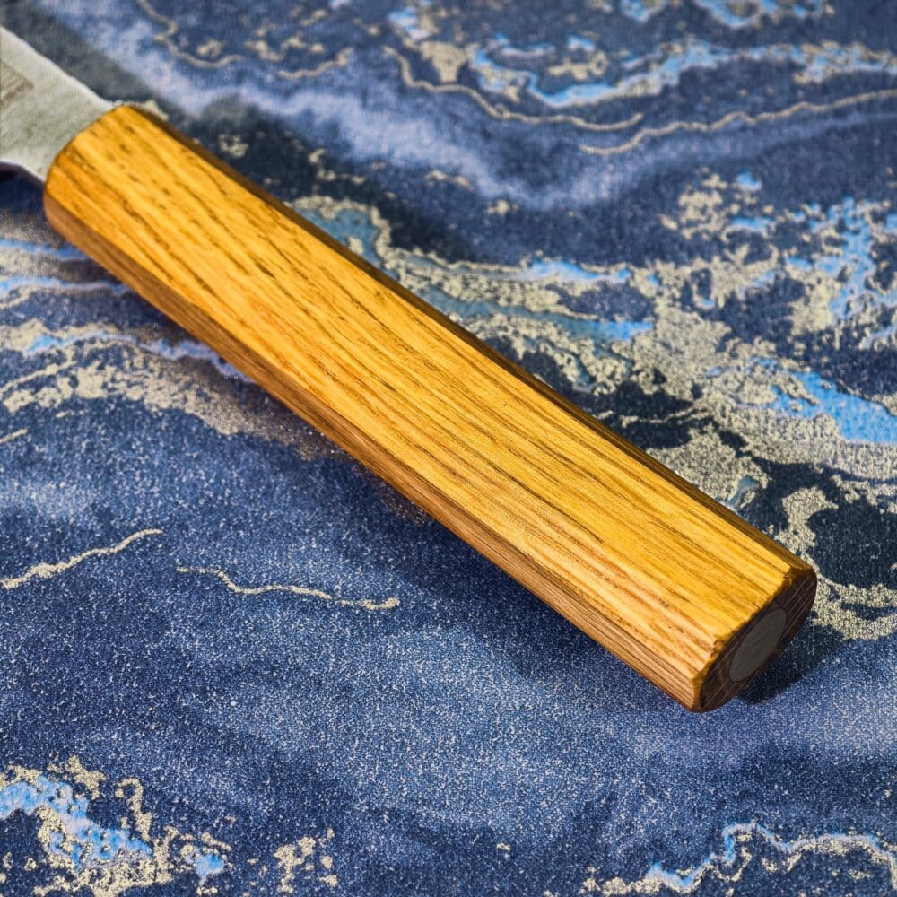 TYR’s light oak handle